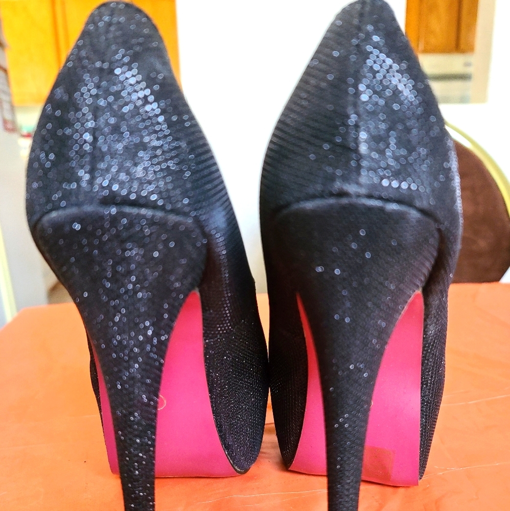 Pink bottom black heels